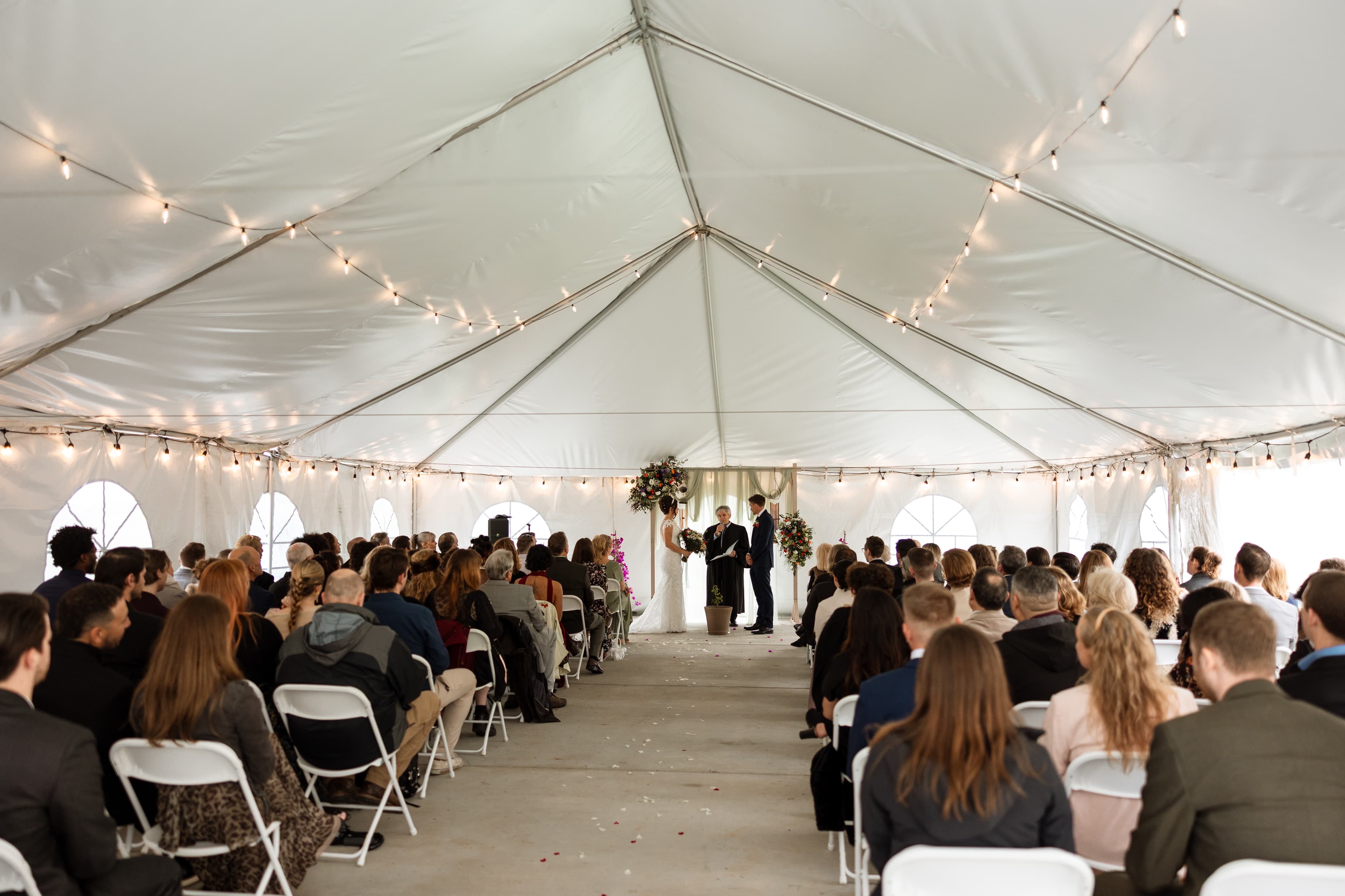 The wedding ceremony under the Wild Loon tent