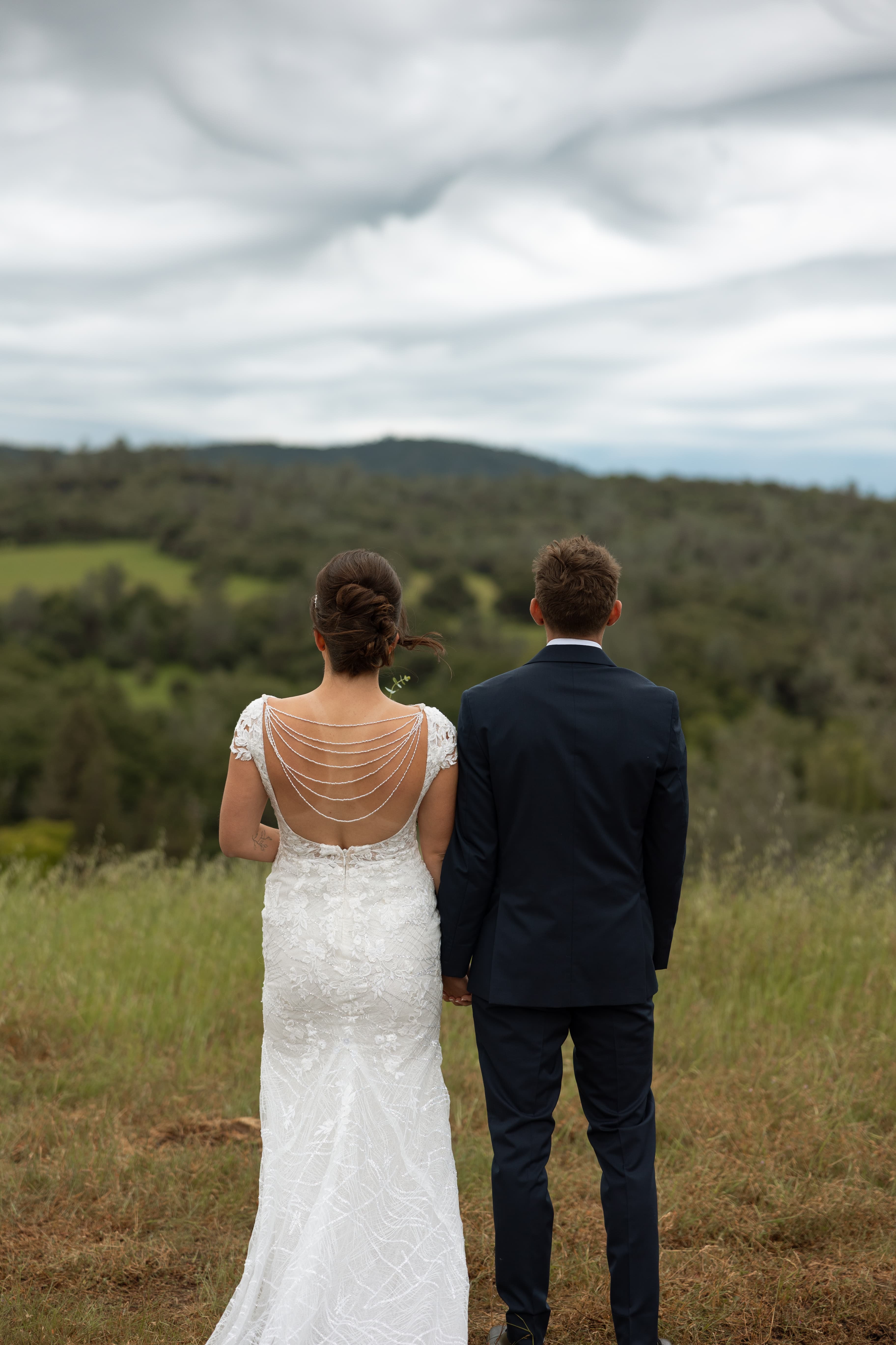 Bride and groom photo on top of our hill
